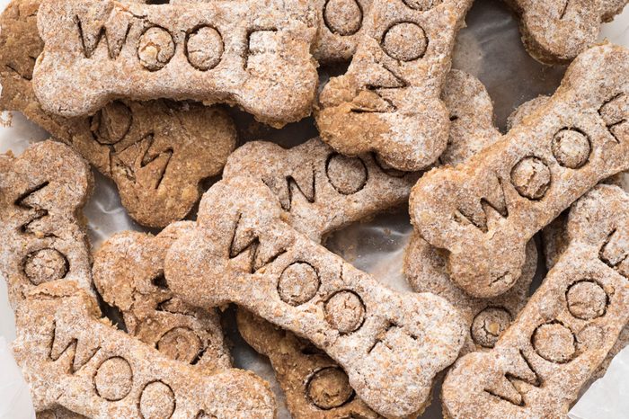 Close-up view of home made dog treats with the word Woof