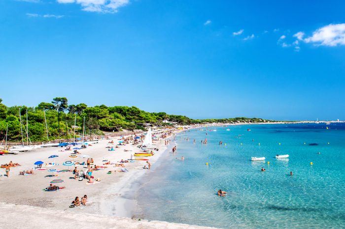 Ibiza, Spain- September 21, 2013: People swimming and sunbathing on the picturesque Las Salinas beach. Ibiza, Balearic islands. Spain