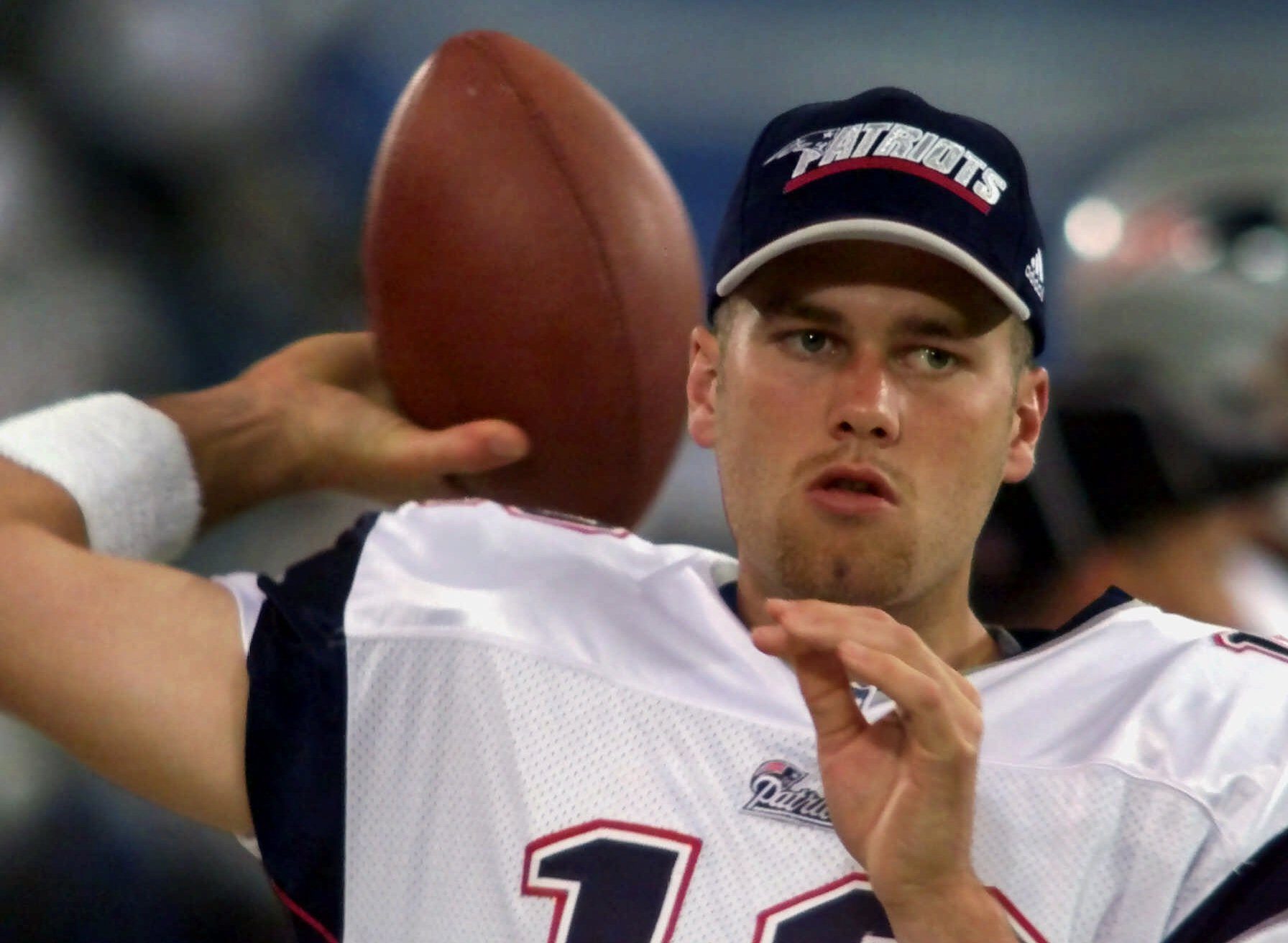 Mandatory Credit: Photo by Carlos Osorio/AP/Shutterstock (6033396a) Tom Brady New England Patriots backup quarterback Tom Brady warms up on the sidelines before an NFL football game against the Detroit Lions at the Silverdome in Pontiac, Mich. Brady grew from a sixth-round draft choice into one of the best quarterbacks in NFL history. On Tuesday, NFL commissioner Roger Goodell hears Brady's appeal of a four-game suspension for using deflated footballs in the AFC championship game. How will that affect Brady's legacy Patriots Bradys Legacy Football, PONTIAC, USA