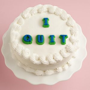 white cake on pink background with 