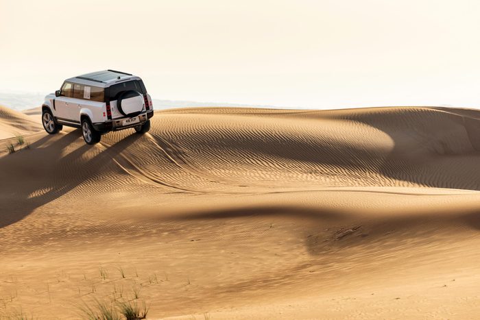 Defender 130 Fuji White in Dubai Dunes