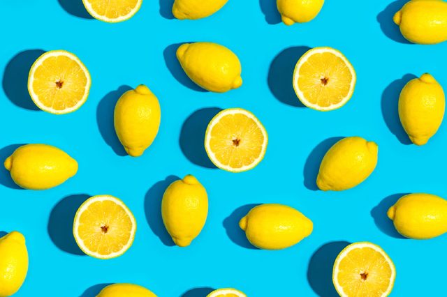 Fresh lemon pattern on a vivid blue background flat lay