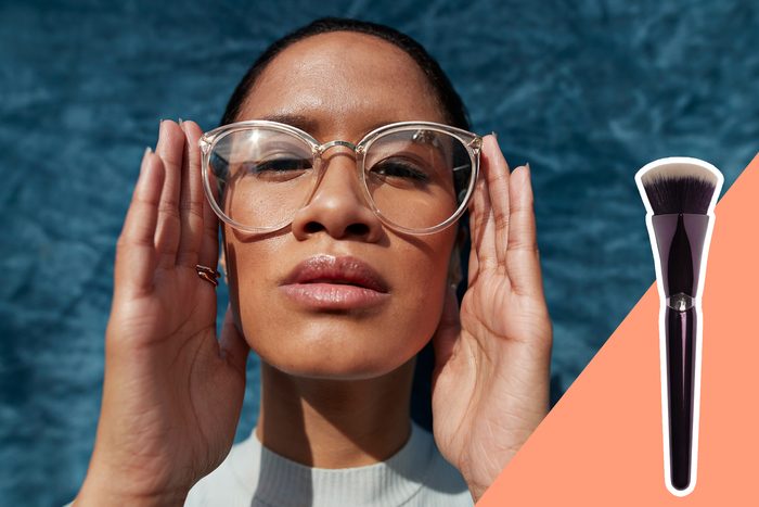 woman wearing glasses with inset of makeup brush