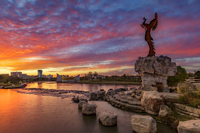 Keeper of the Plains and City Skyline at Sunrise