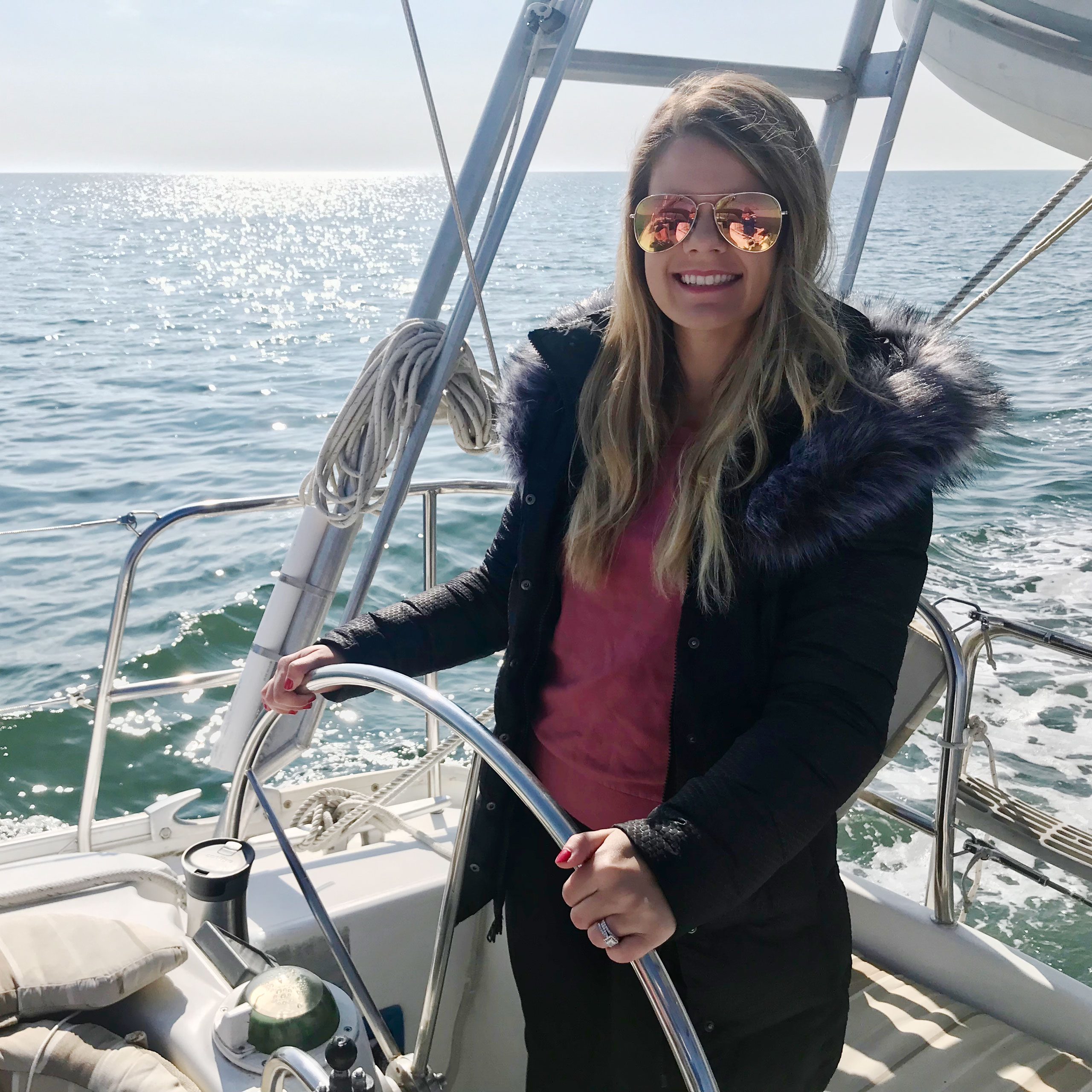 Rachel Hartley driving the boat to new york