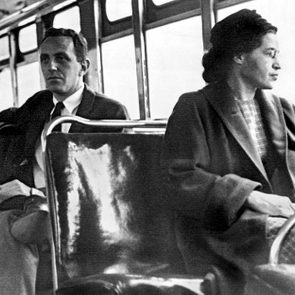 Black and white photo of Rosa Parks sitting on a bus seat