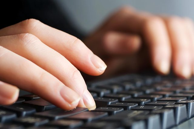 close up of typing on keyboard