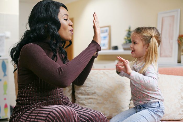African American woman playing with girl.; Shutterstock ID 583567765; Job (TFH, TOH, RD, BNB, CWM, CM): RD