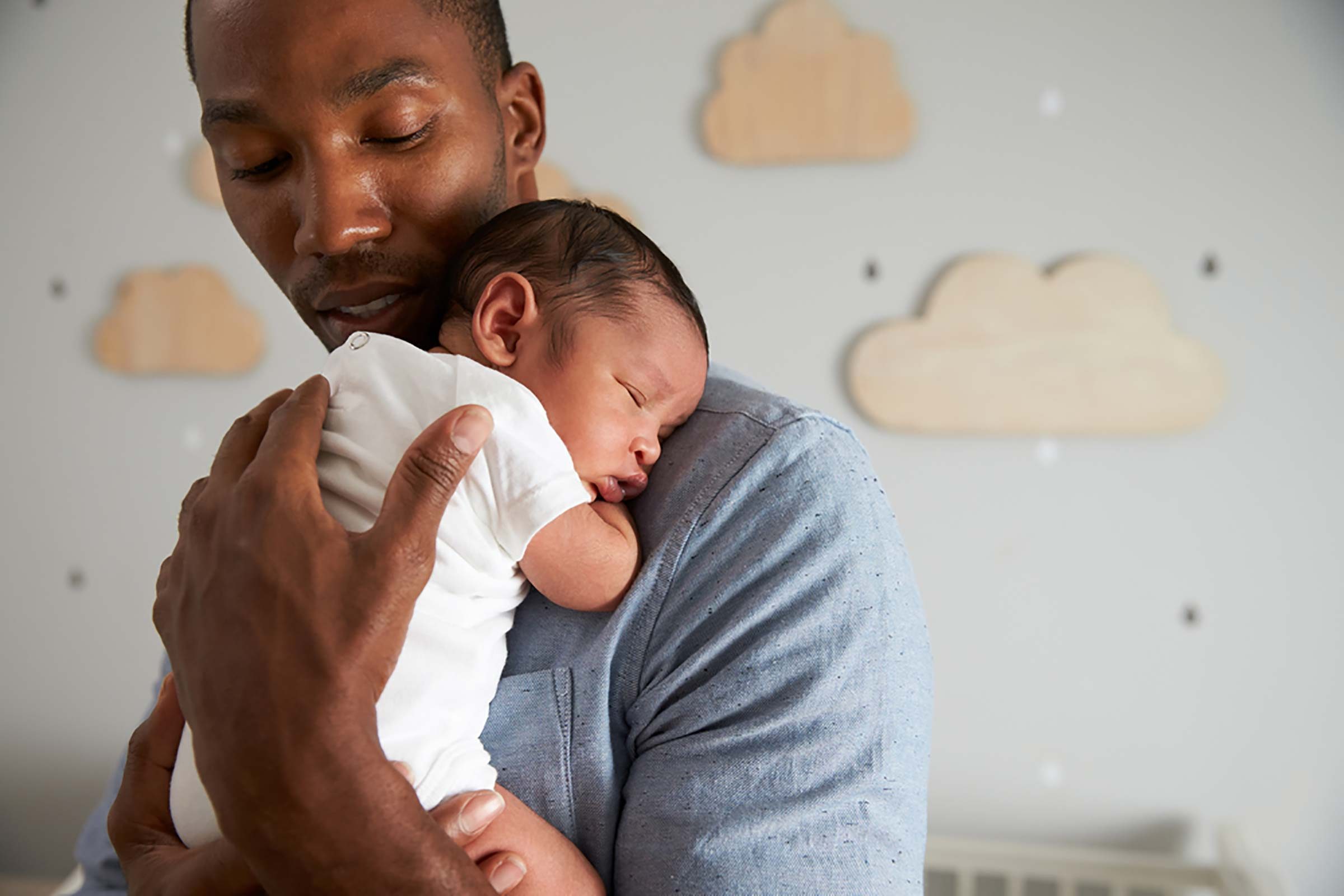 dad holding newborn baby