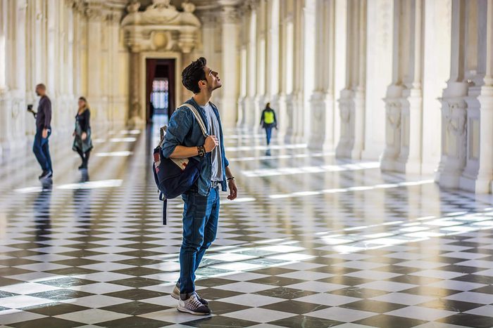young man at a museum by himself