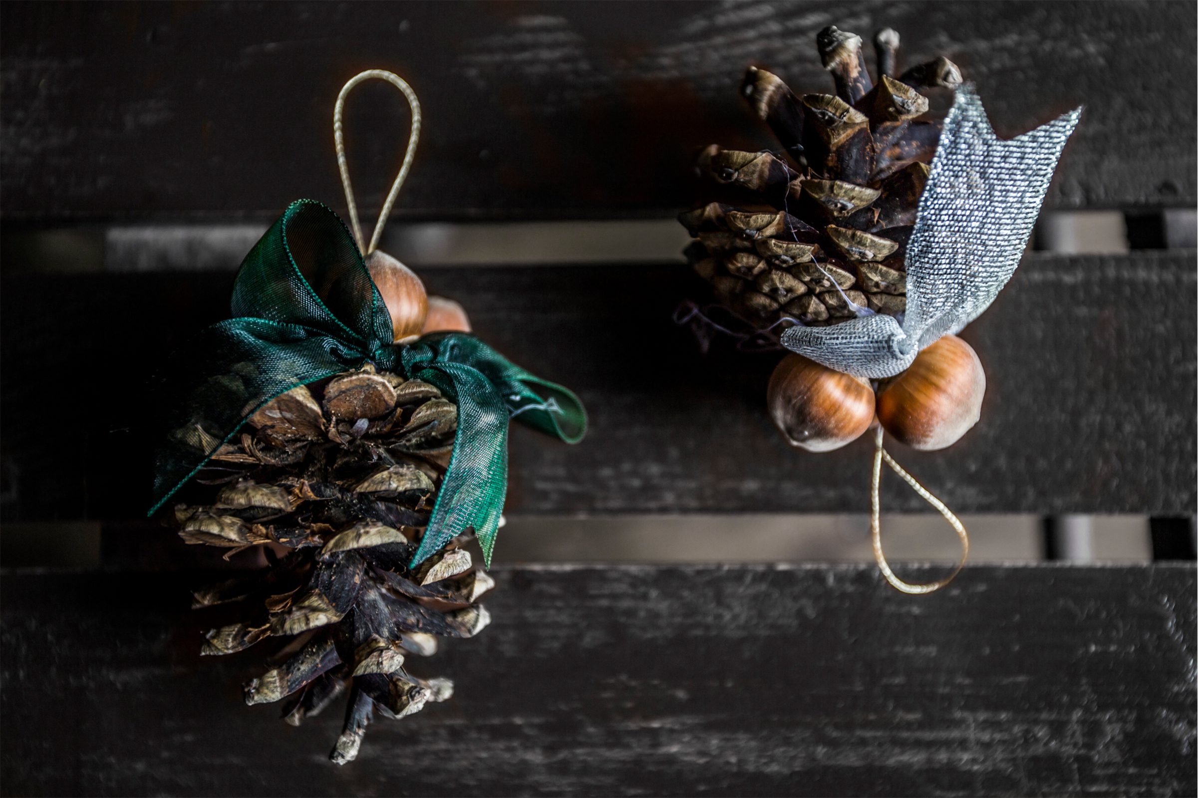 Christmas ornaments made form pine cone and hazelnut