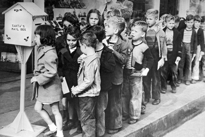 Downey, California: 1947. A group of children line up to mail their letters to Santa at special mail boxes set up through out the town by the Chamber of Commerce. Volunteer women will answer each letter.