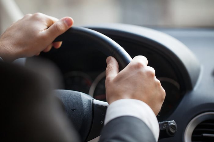 Business man driving his car