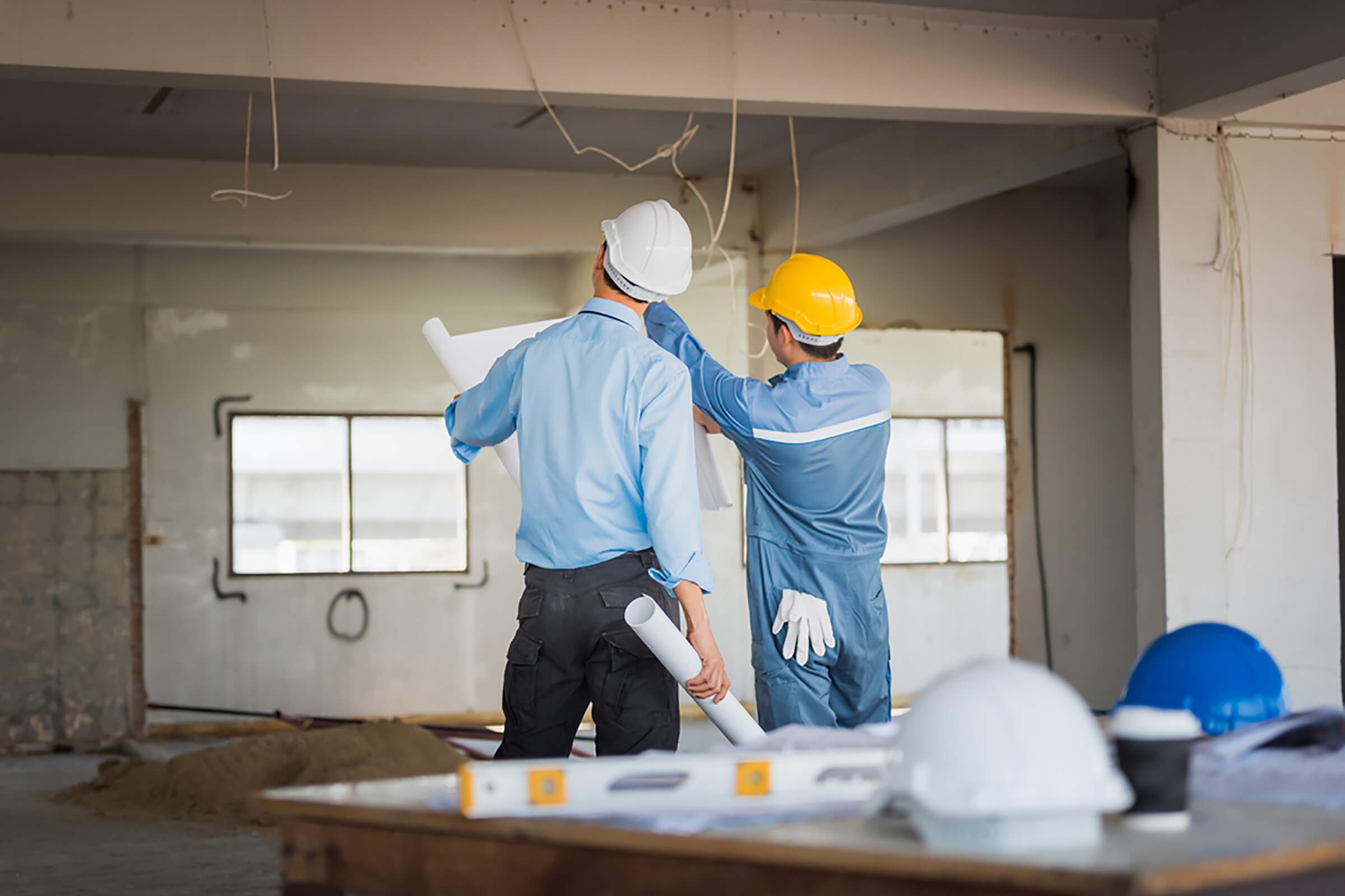 home renovation construction men fixing damp wall, wet wall, condensation, moisture