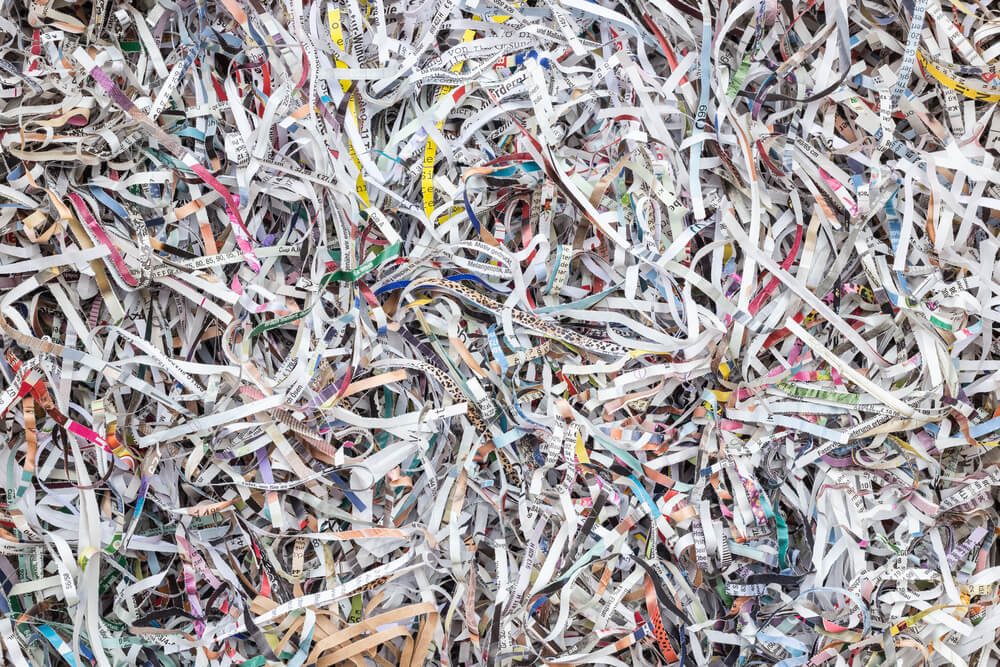 Close up stack of scrap paper from paper cutter for background