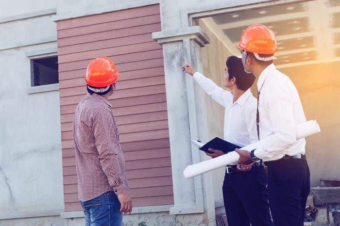 architect and engineer inspect housing estate building to success construction plan before send quality housing to customers