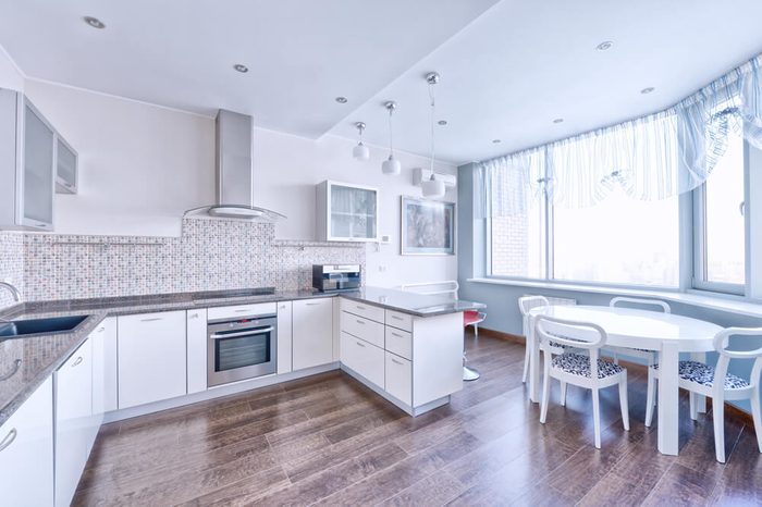 Interior design of a modern white kitchen in a new house.