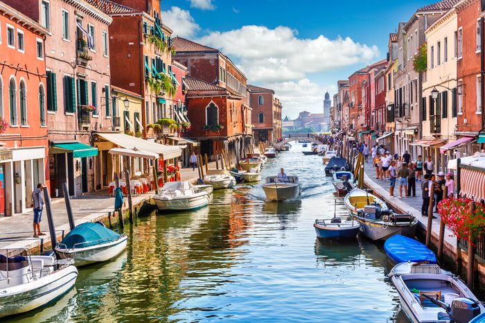 Island murano in Venice Italy. View on canal with boat and motorboat water. Picturesque landscape.