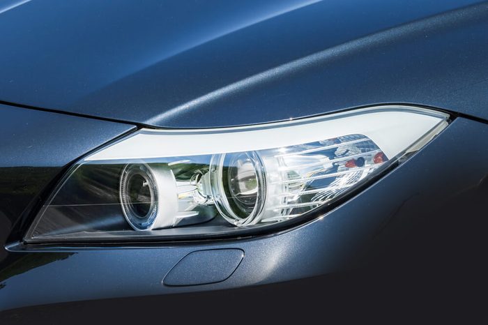 Headlight of the dark blue car