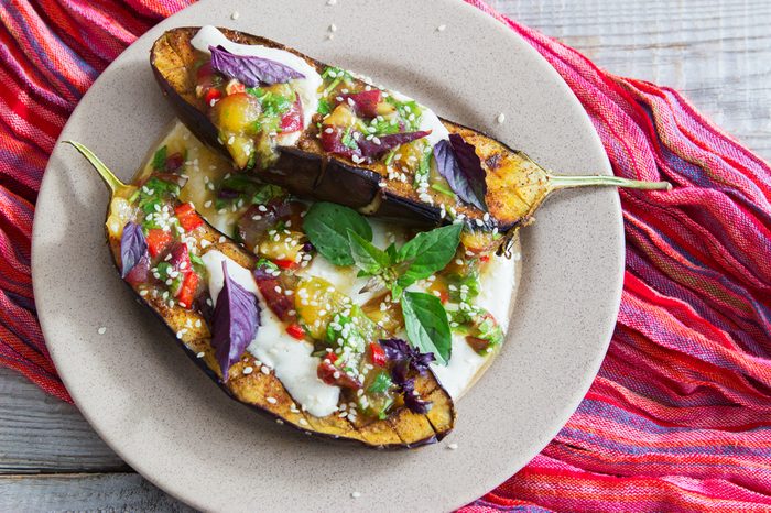 Baked eggplants plum salsa greek yogurt tahini sauce.