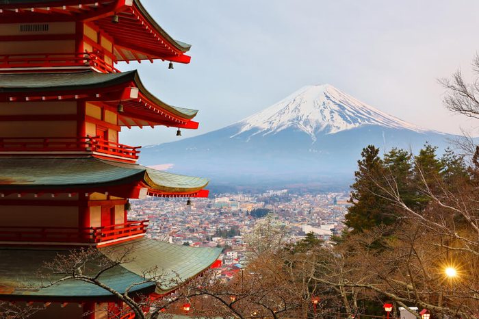 Beautiful Mount Fuji Viewed from behind Chureito Pagoda at Twilight, Fujiyoshida Japan. Chureito pagoda is a five storied pagoda facing Fuji, built as part of Arakura Sengen Shrine in 1963