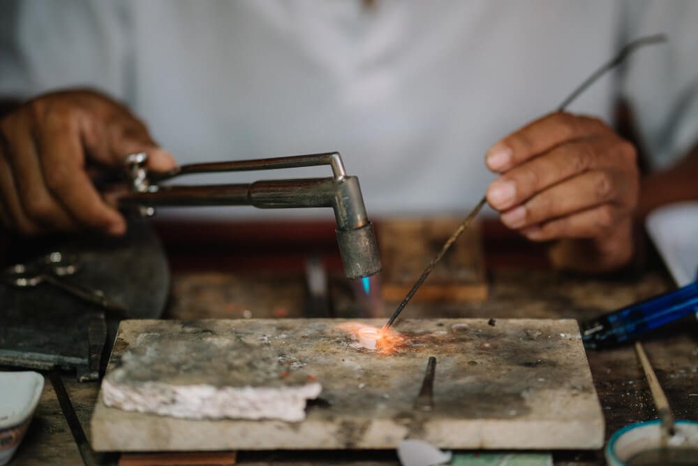 Asians are using fire to bring silverware to add to the beauty of diamonds were paired together ,Learning skills concept.