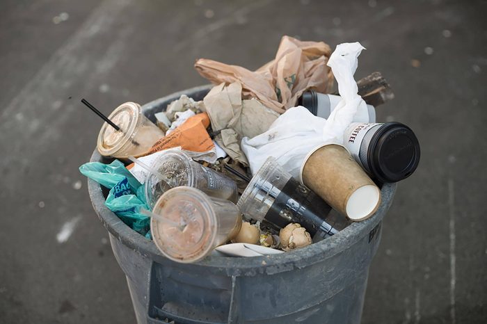 BROOKLYN, NY - May 25, 2015: A bin-full of trash on the street of New York City.