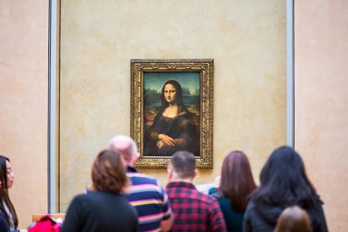 PARIS, FRANCE - FEBRUARY 06, 2016: Visitors take photo of Leonardo DaVinci's "Mona Lisa" at the Louvre Museum