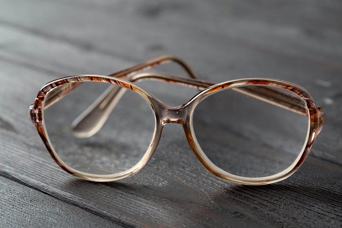 eyeglasses on wooden table