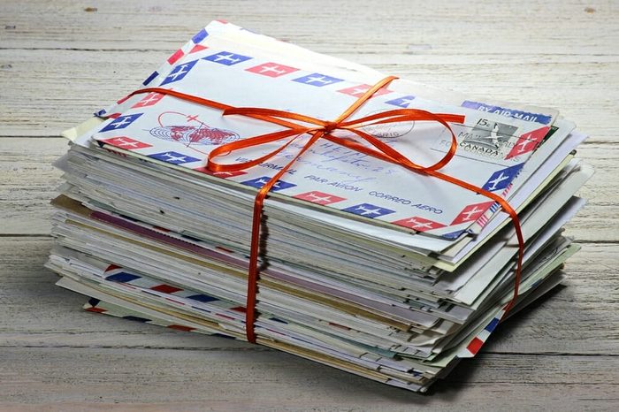 bundle of old letters on wooden background