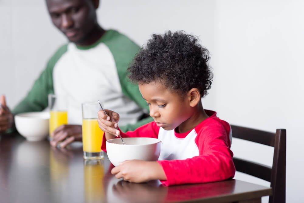 child eating cereal