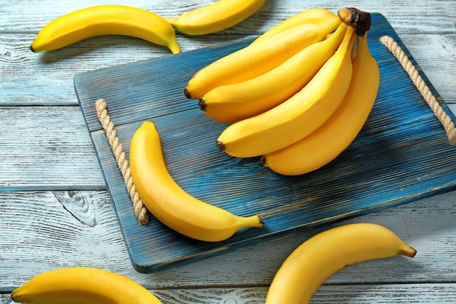 Yummy bananas on wooden background