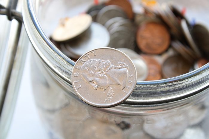 Glass Jar full of coins (Finance concept)