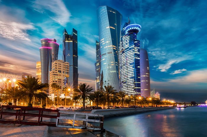 The skyline of Doha city center after sunset, Qatar