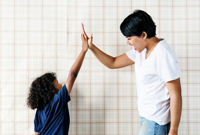 Young boy helping mom