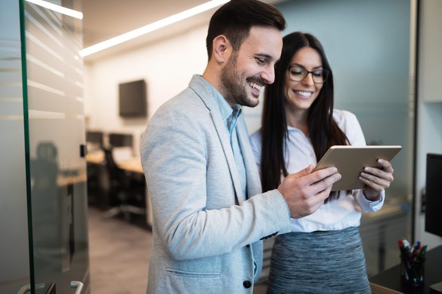 Business people having fun and chatting at workplace office