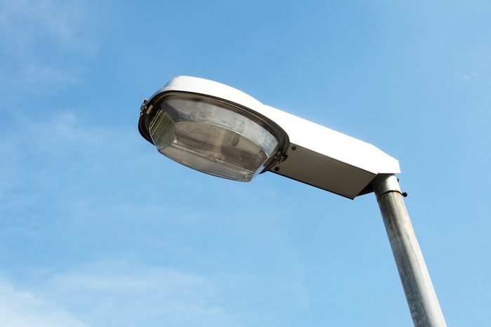 Street lamp with blue sky background.