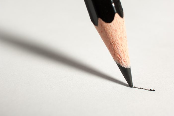 Close up of a pencil writing on paper.