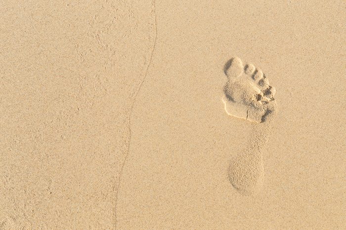 foot prints on sand at the beach in the afternoon, Phuket, Thailand