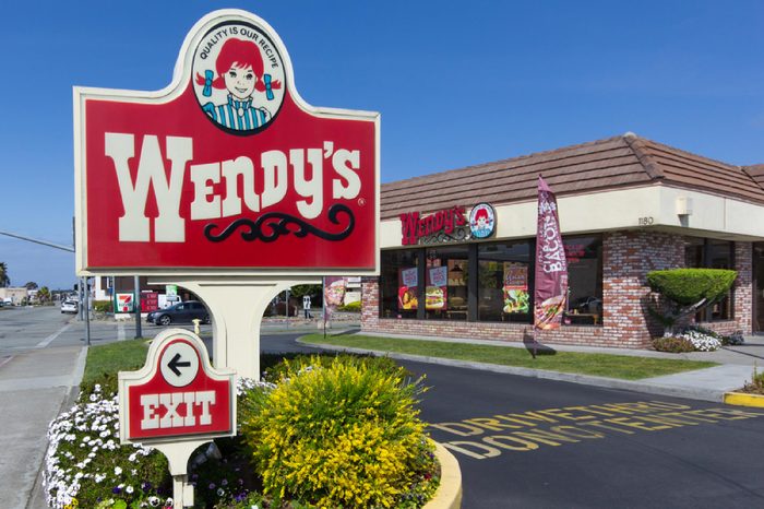 SEASIDE, CA/USA - MARCH 27, 2014: Wendy's fast food restaurant exterior and sign. Wendy's is the world's third largest hamburger fast food chain with approximately 6,650 locations.