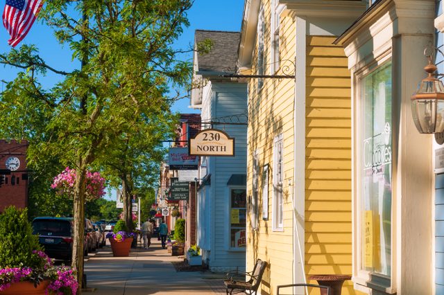 HUDSON, OH - JUNE 14, 2014: Quaint shops and businesses on Hudson's Main Street maintain a charming and inviting appearance that makes it a pedestrian shopper's mecca.