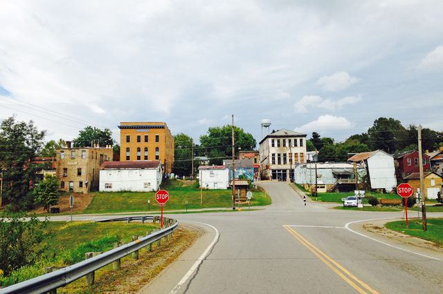 An intersection is seen with a small-town that typifies the rural Midwest beyond. 