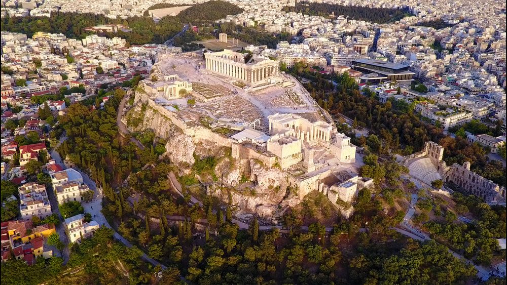 Aerial birds eye view photo taken by drone of iconic Acropolis hill and the Parthenon, Athens historic center, Attica, Greece