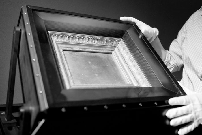 Staff Member Stephanie Oeben Stands Next to what is Said to Be the World's Oldest Surviving Photograph at the Reiss Engelhorn Museums in Mannheim Germany 30 July 2012 the Photo From 1826 Entitled 'View From the Window at Le Gras' by French Photography Pioneer Joseph Nicephore Niepce Will Be Part of the Exhibition 'The Birth of Photography' Which Open on 09 September 2012 Germany Mannheim