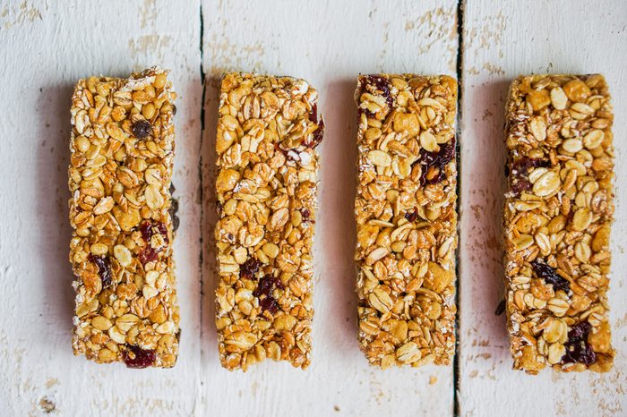 Granola bars on wooden background