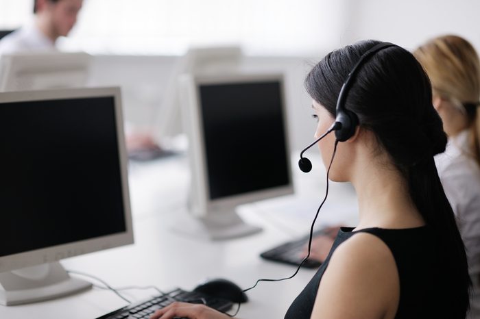 business people group with headphones giving support in help desk office to customers, manager giving training and education instructions