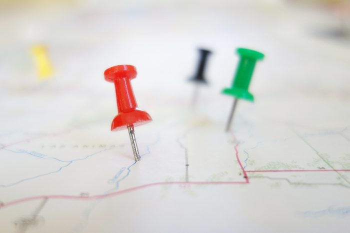 Closeup of push pin tacks in a map 