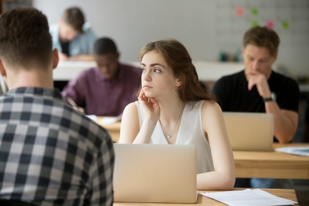 Thoughtful young female worker distracted from work thinking about problem solution and company success strategies. Freelancer imagining bright future, great opportunities, new life and beginnings