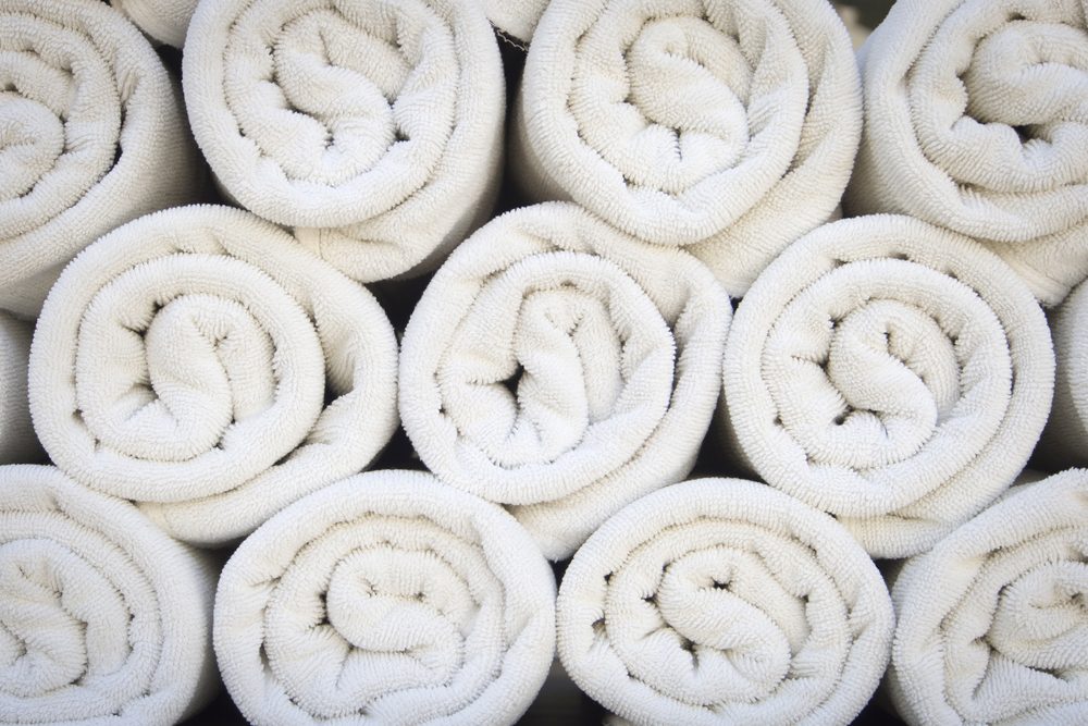 Rolled up white spa towels