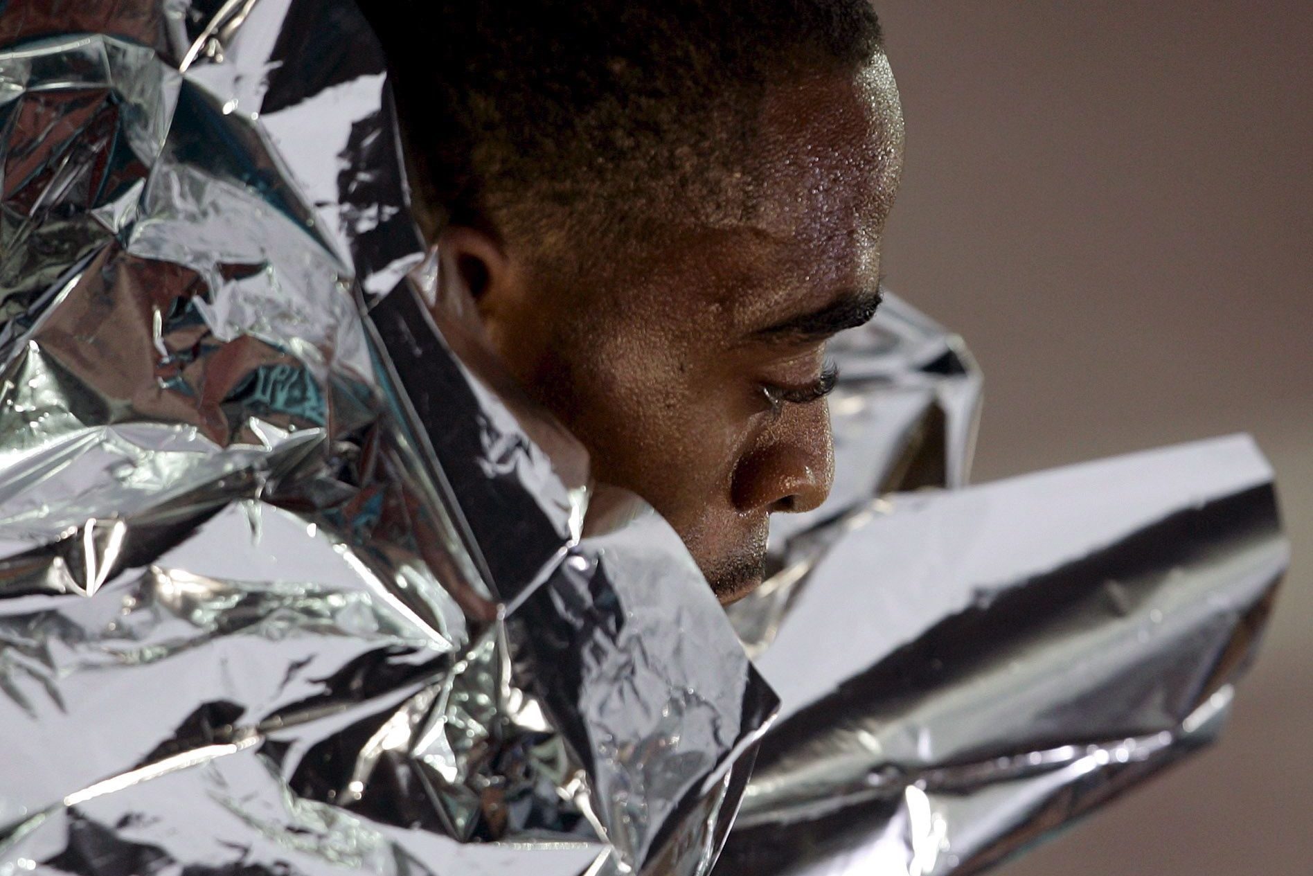 close up of man wrapped in a space blanket